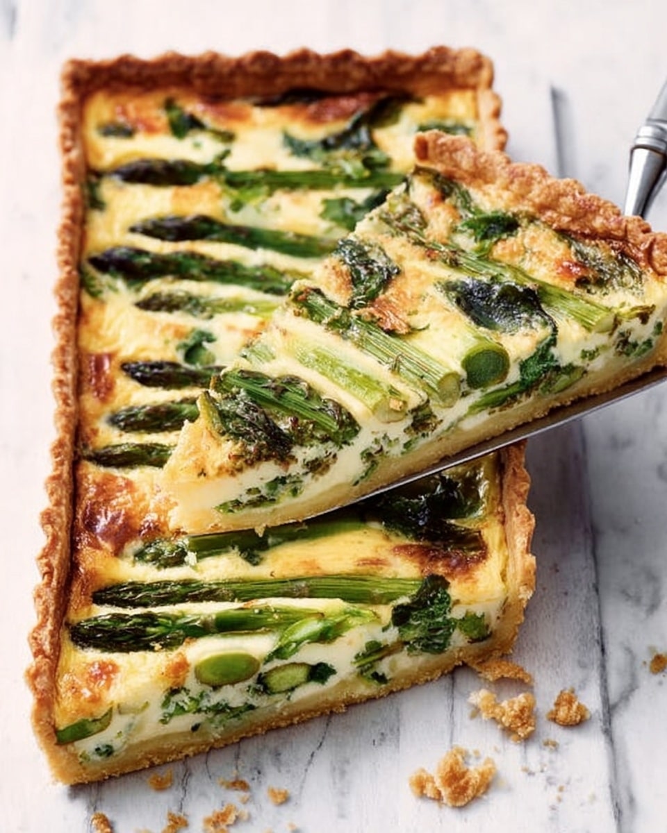 A rectangular tart is shown on a white marbled surface, with a golden-brown crispy crust forming the base and edges. The tart has two layers visible: the bottom layer is a creamy, pale yellow filling that looks soft and smooth, and the top layer consists of green vegetable pieces, likely asparagus, and some melted light yellow cheese that is slightly browned and bubbly. A woman's hand holds a metal spatula lifting a slice from the tart, showing the same layers clearly from the side. Photo taken with an iphone --ar 4:5 --v 7