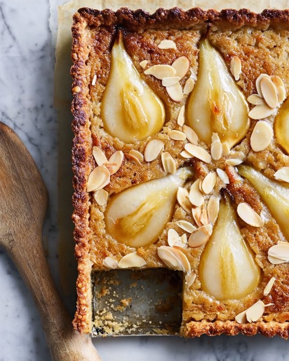 A square tart with a golden brown crust forms the base layer, rough and slightly crumbly at the edges, holding a dense, light brown filling that looks soft and moist. Six pear halves are arranged evenly on top, their pale yellow skin contrasting with the rich filling, with each pear half showing a slightly glossy, syrupy sheen. Thin, toasted almond slices are scattered across the whole tart, adding texture and a light tan color that breaks the smooth surface. The tart is placed on a white marbled tabletop, and a wooden spatula lies next to it. The cut-out section reveals the soft inside and the thick crust. photo taken with an iphone --ar 4:5 --v 7