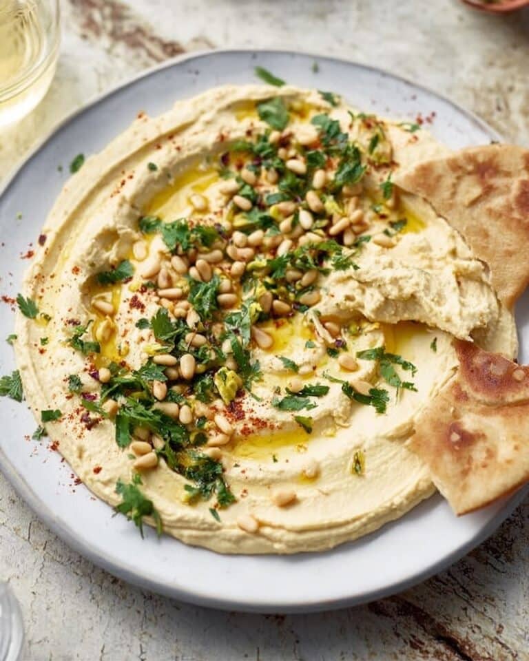 Lemony Spiced Hummus with Harissa, Pine Nuts, and Fresh Herbs Recipe