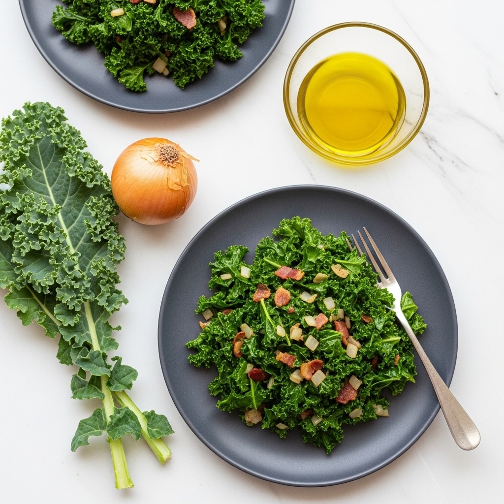 Two plates of cooked kale mixed with bits of onion and small pieces of bacon sit on a white marbled surface. Each plate is white and round, holding a dark green, slightly shiny pile of kale with light green and pale yellow stems, scattered light pink bacon bits, and small pieces of translucent cooked onion. One plate is in the foreground with a silver fork resting on its right edge. Next to this plate are fresh kale leaves and a whole brown onion. Above this plate is a small clear glass bowl filled with golden olive oil, all placed on the white marbled surface. Photo taken with an iphone --ar 4:5 --v 7