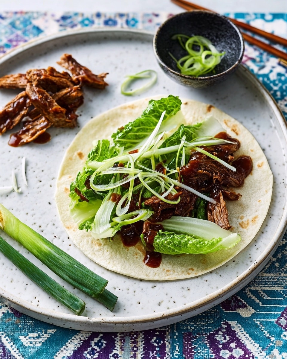 A white ceramic plate shows a soft, round tortilla at the center, topped with a layer of fresh light green lettuce leaves, followed by grilled pieces of golden-brown chicken glazed with a dark sauce. On top, there are thin strips of pale green scallions scattered evenly. To the left on the plate, extra grilled chicken pieces and some scallions are placed. A small black bowl filled with more scallions is beside the plate on a white marbled surface with a blue patterned background visible. Photo taken with an iphone --ar 4:5 --v 7