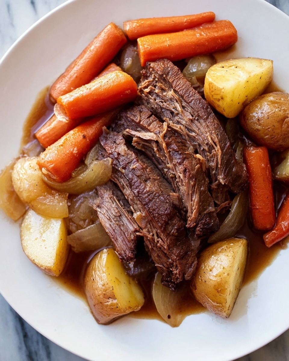 A white plate holds a serving of pot roast with three visible layers of dark brown, tender sliced beef on the right side. Surrounding the meat are chunky pieces of pale yellow potatoes with a soft texture, bright orange baby carrots, and light brown cooked onions. These vegetables are mixed together and sit in a small pool of rich brown gravy, giving a glossy finish to the whole dish. The background is a white marbled texture. photo taken with an iphone --ar 4:5 --v 7